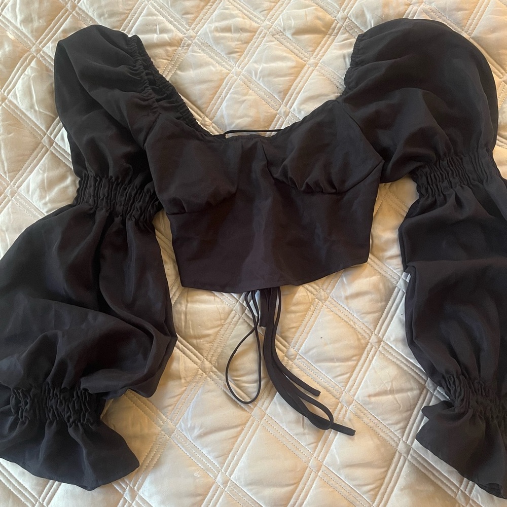 Black cropped (back out) blouse with bell sleeved. Super cute. Size: Large.